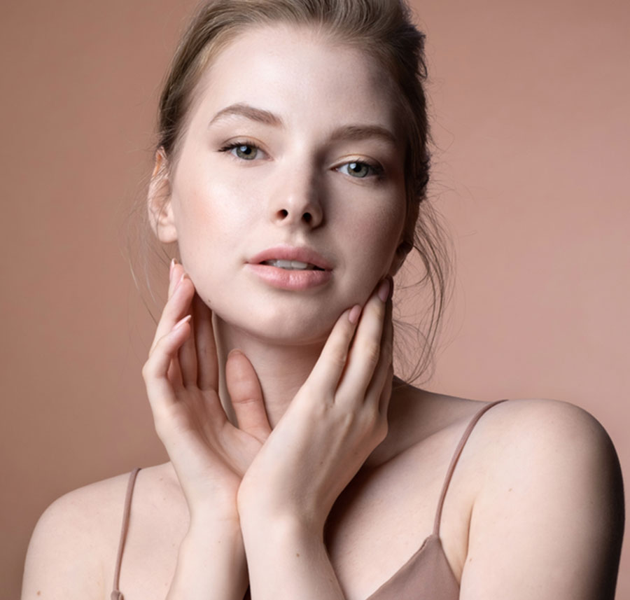 Woman with radiant skin after European facial treatment.