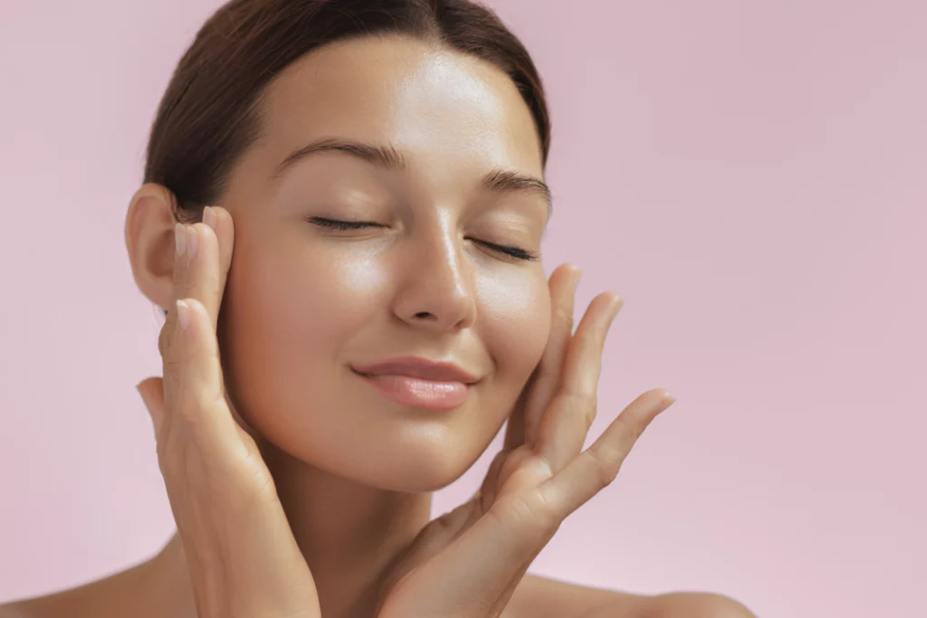 Woman with glowing skin enjoying the effects of facials.