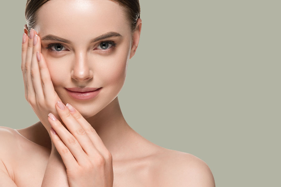 A woman with radiant skin showing results of skin rejuvenation and overall glow.